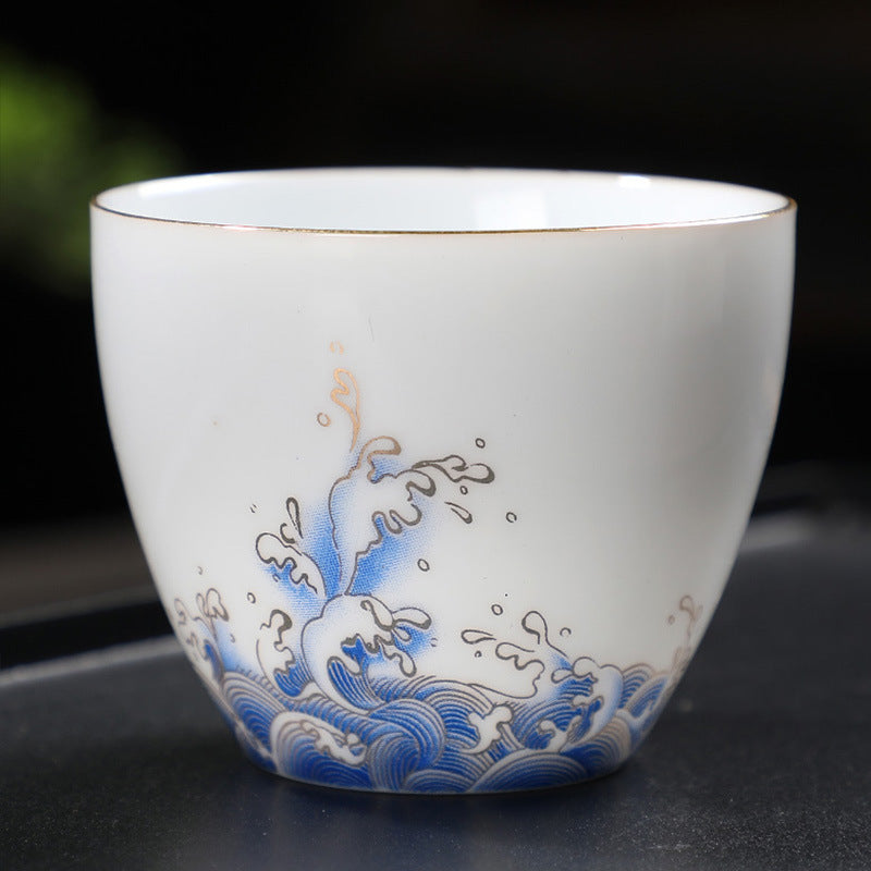 Minimalist Hand-Painted Dehua Suet White Porcelain Tea Cup - Blue Lotus Motif