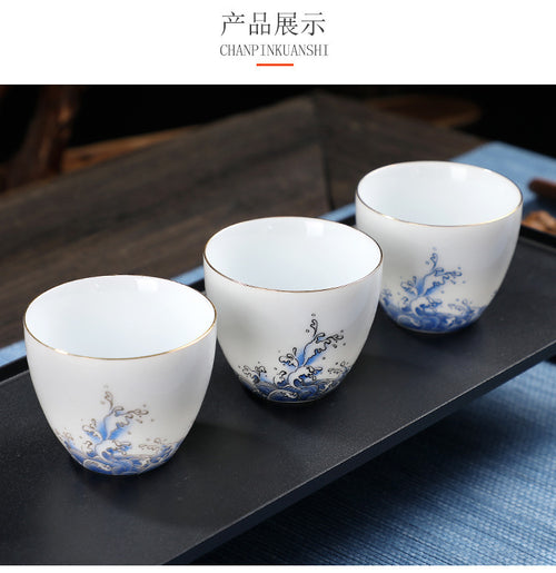 Minimalist Hand-Painted Dehua Suet White Porcelain Tea Cup - Blue Lotus Motif