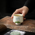 Minimalist Hand-Painted Dehua Suet White Porcelain Tea Cup - Blue Lotus Motif