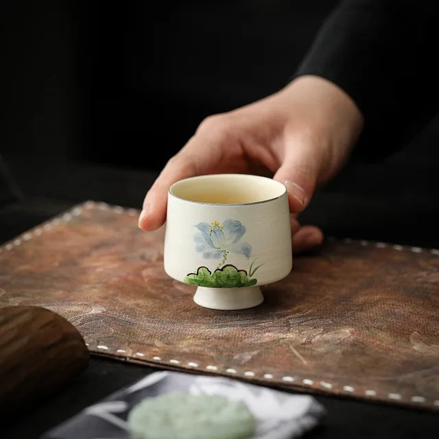 Minimalist Hand-Painted Dehua Suet White Porcelain Tea Cup - Blue Lotus Motif